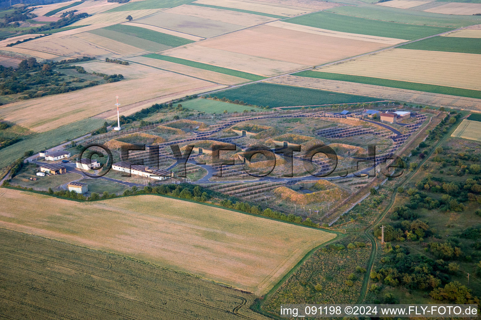 Panel rows of photovoltaic and solar farm or solar power plant bei Relaisfunkstelle DB0FTC in Bockenheim an der Weinstrasse in the state Rhineland-Palatinate, Germany