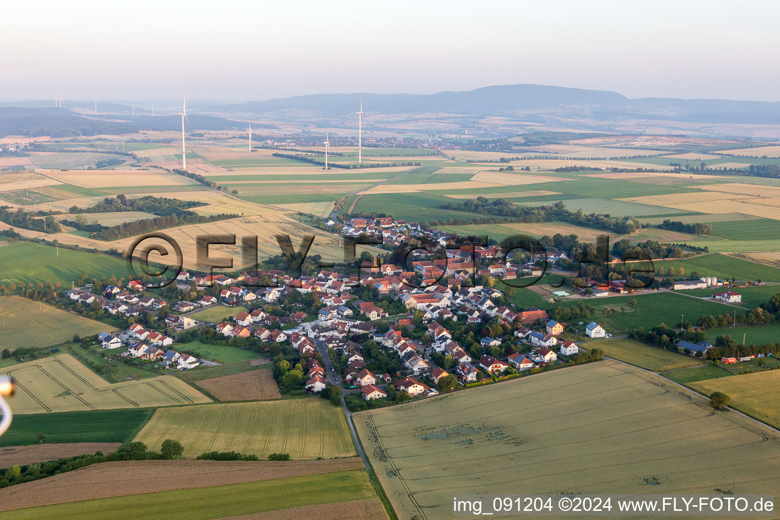 Village - view on the edge of agricultural fields and farmland in Lautersheim in the state Rhineland-Palatinate, Germany
