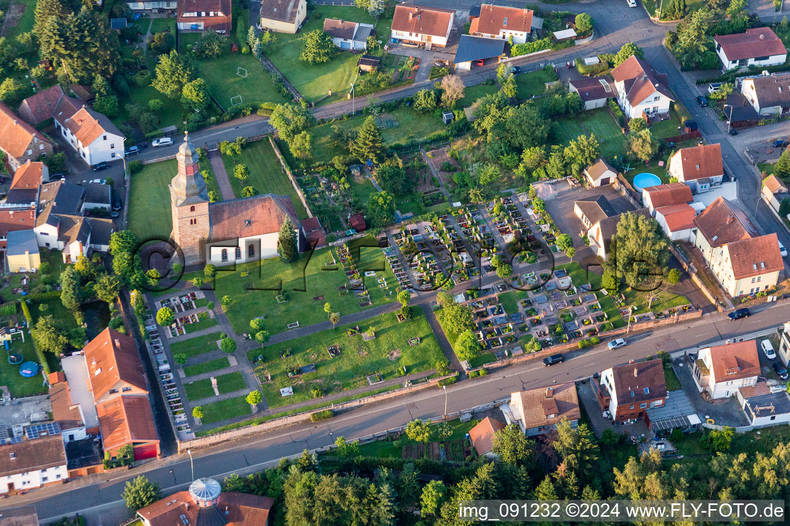 Grave rows on the grounds of the cemetery near the church in Sippersfeld in the state Rhineland-Palatinate, Germany