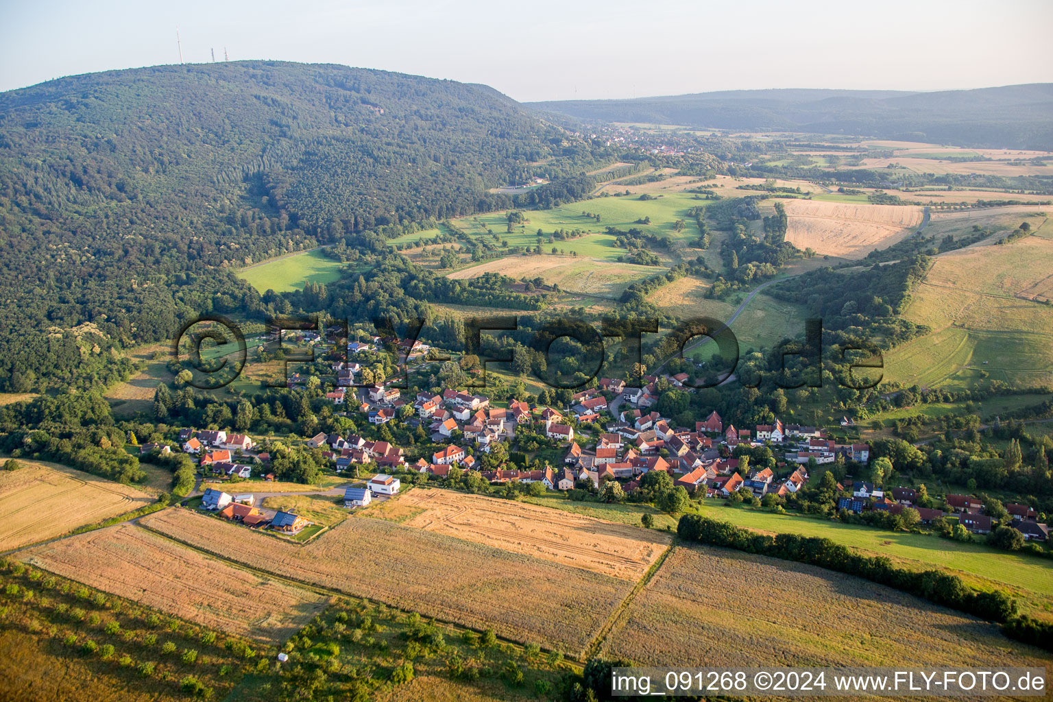 Village - view on the edge of agricultural fields and farmland in Jakobsweiler in the state Rhineland-Palatinate, Germany