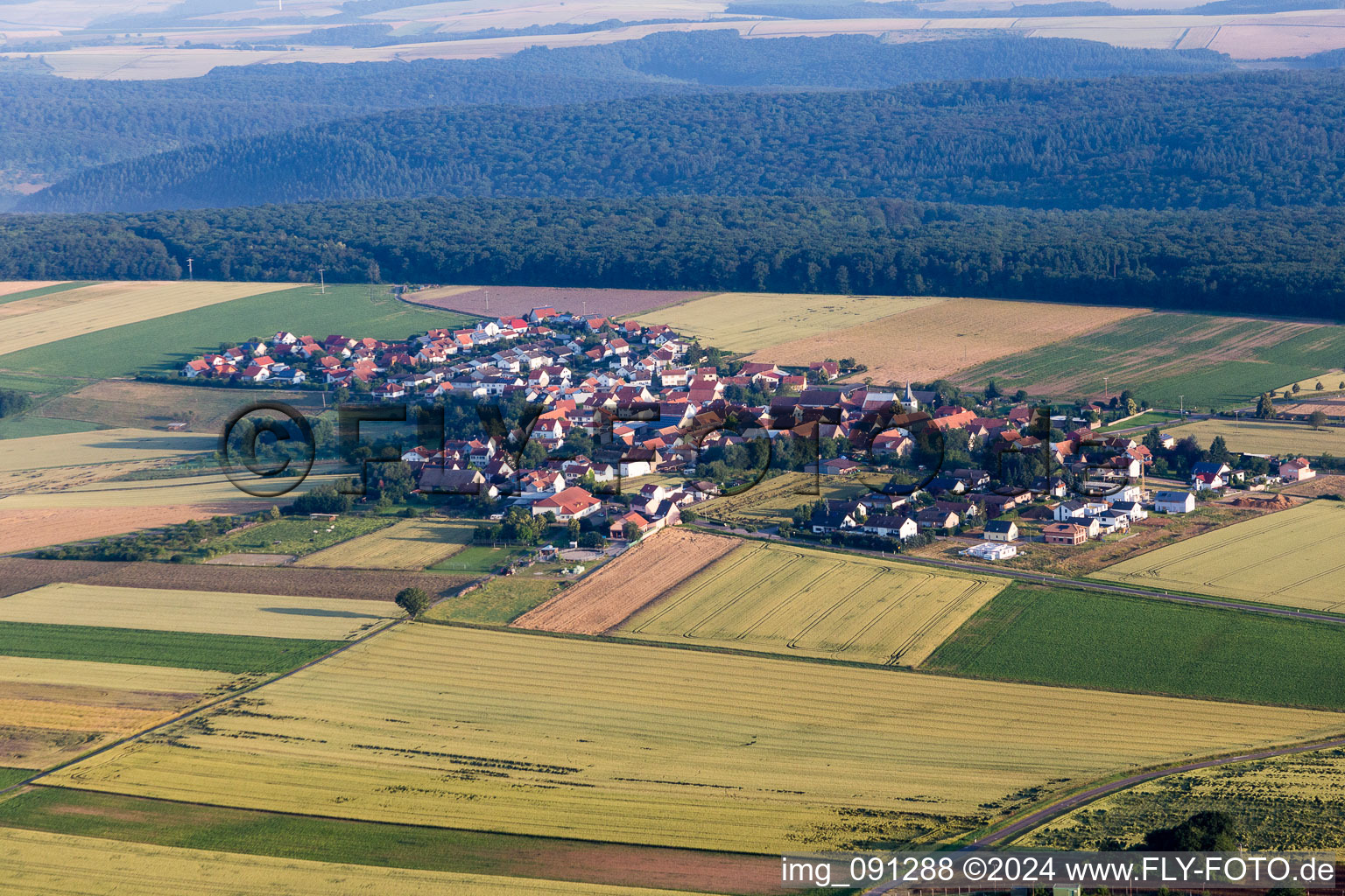 Village - view on the edge of agricultural fields and farmland in Orbis in the state Rhineland-Palatinate, Germany