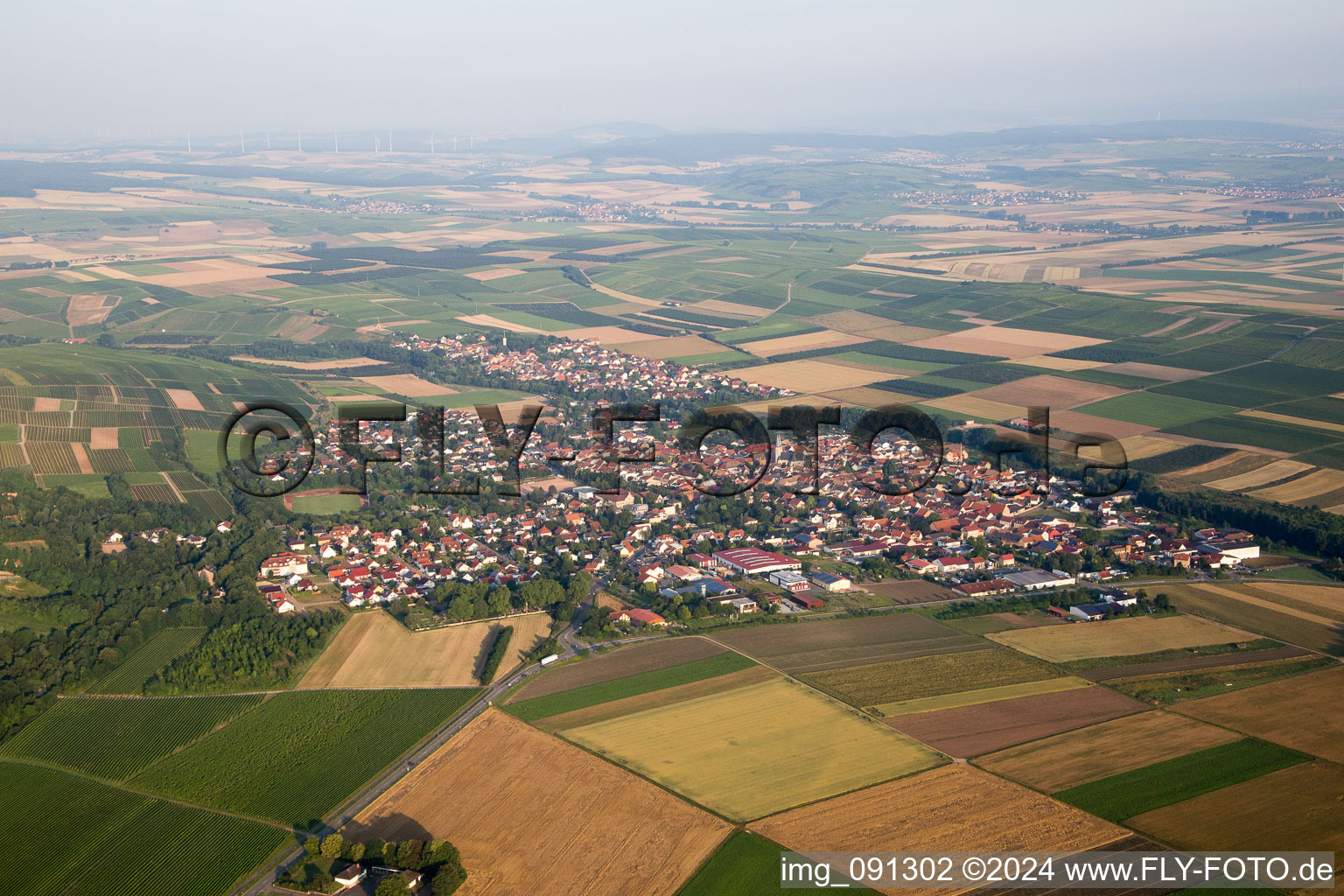 Aerial view of Village - view on the edge of agricultural fields and farmland in Flonheim in the state Rhineland-Palatinate, Germany