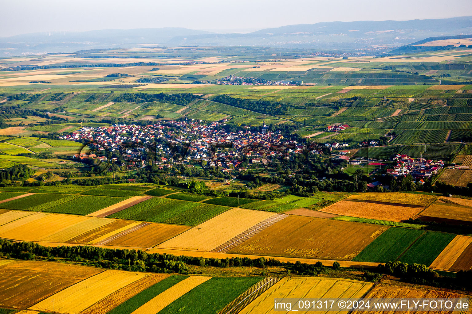 Village - view on the edge of agricultural fields and farmland in Jugenheim in Rheinhessen in the state Rhineland-Palatinate, Germany