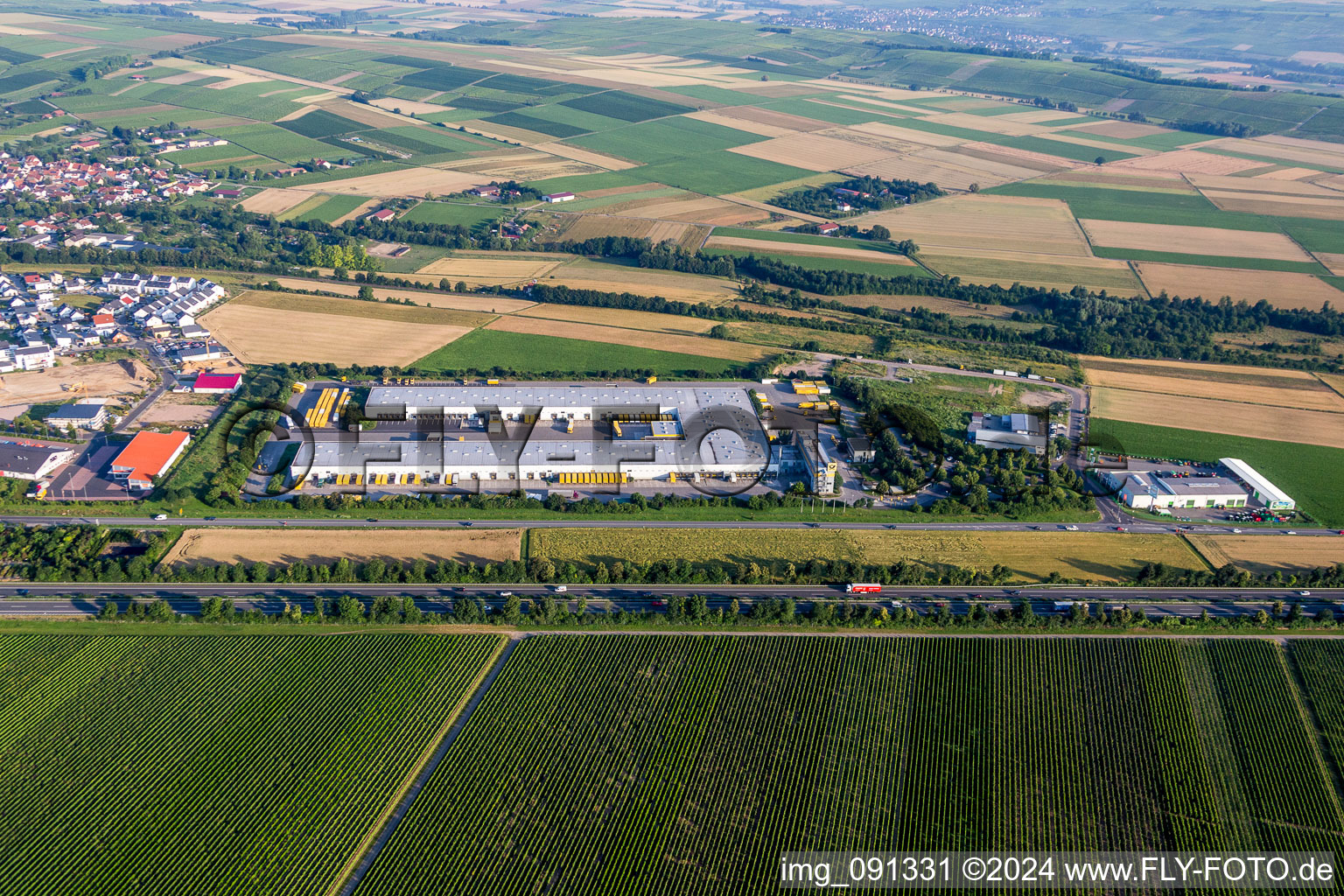 Aerial view of Building complex and grounds of the logistics center of DHL in Saulheim in the state Rhineland-Palatinate, Germany