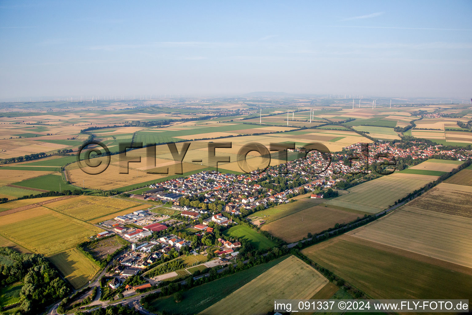 Village - view on the edge of agricultural fields and farmland in Undenheim in the state Rhineland-Palatinate, Germany