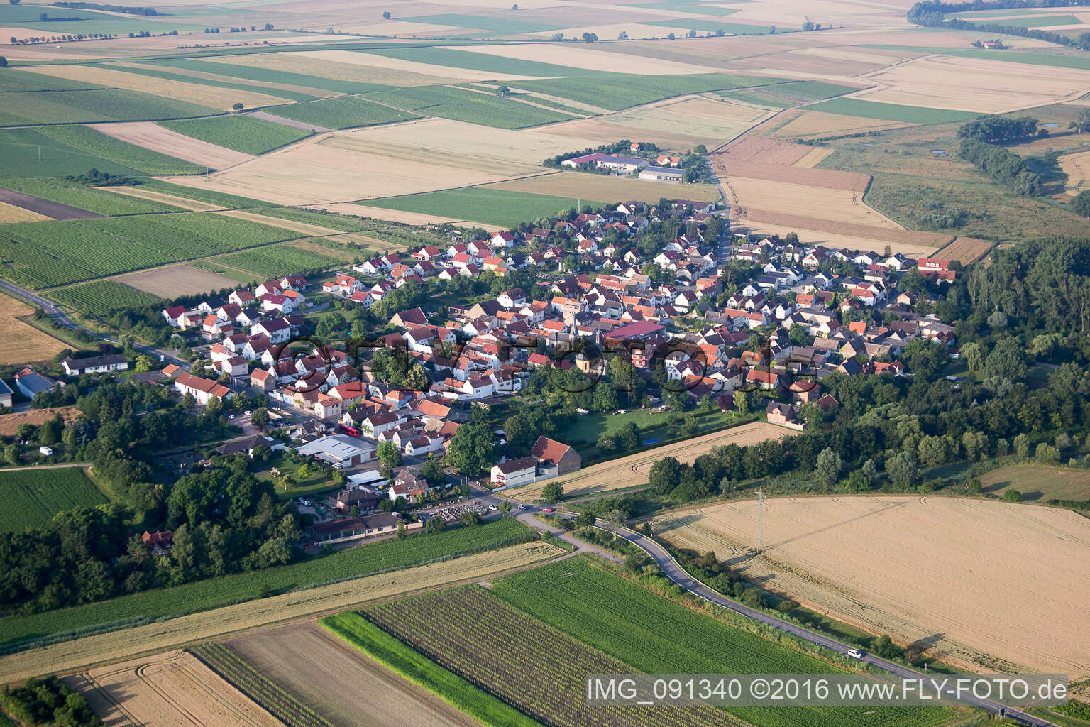 Village - view on the edge of agricultural fields and farmland in Friesenheim in the state Rhineland-Palatinate, Germany