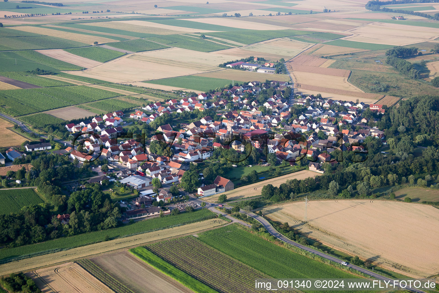 Village - view on the edge of agricultural fields and farmland in Friesenheim in the state Rhineland-Palatinate, Germany