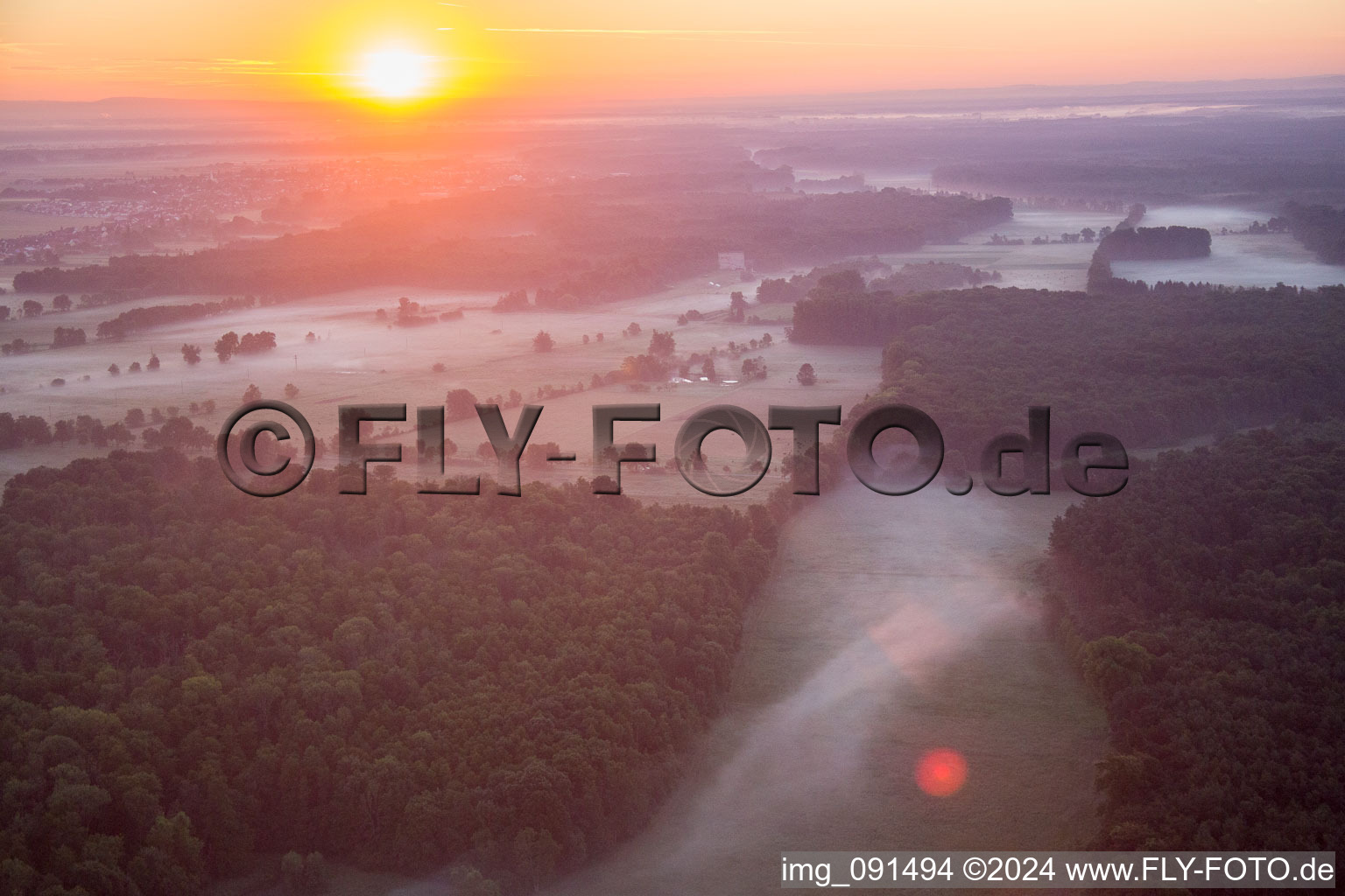 Sunrise in morning mist over the countryside Bruchbach-Otterbachniederung in Kandel in the state Rhineland-Palatinate