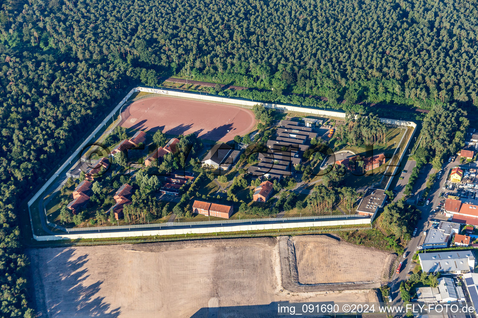 Prison grounds and high security fence Prison Jugendstrafanstalt Schifferstadt in Schifferstadt in the state Rhineland-Palatinate, Germany