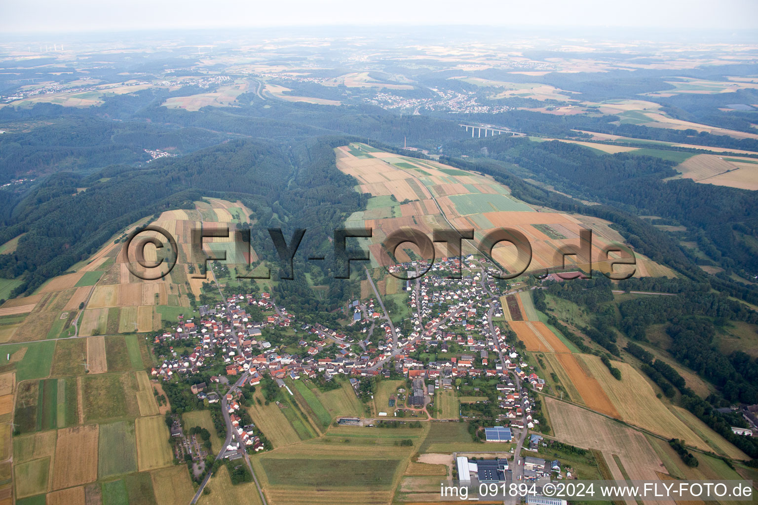 Village - view on the edge of agricultural fields and farmland in Donsieders in the state Rhineland-Palatinate