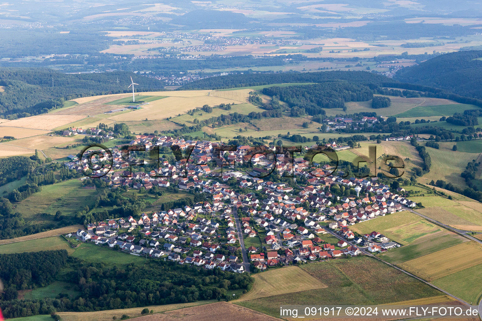 Village - view on the edge of agricultural fields and farmland in Martinshoehe in the state Rhineland-Palatinate, Germany