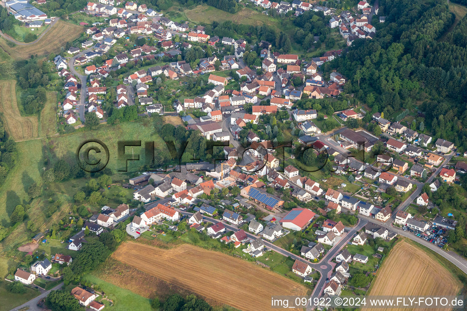 Village - view on the edge of agricultural fields and farmland in Lambsborn in the state Rhineland-Palatinate, Germany