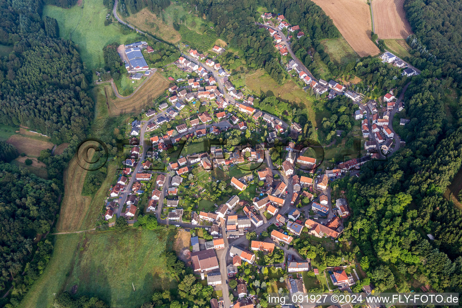 Aerial view of Village - view on the edge of agricultural fields and farmland in Lambsborn in the state Rhineland-Palatinate, Germany