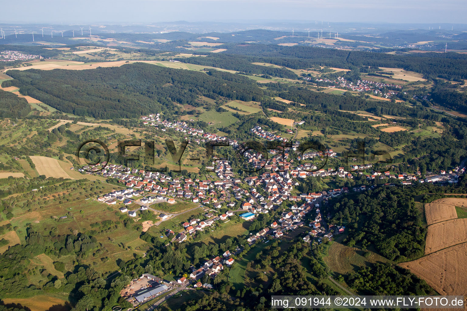 Village - view on the edge of agricultural fields and farmland in Dittweiler in the state Rhineland-Palatinate