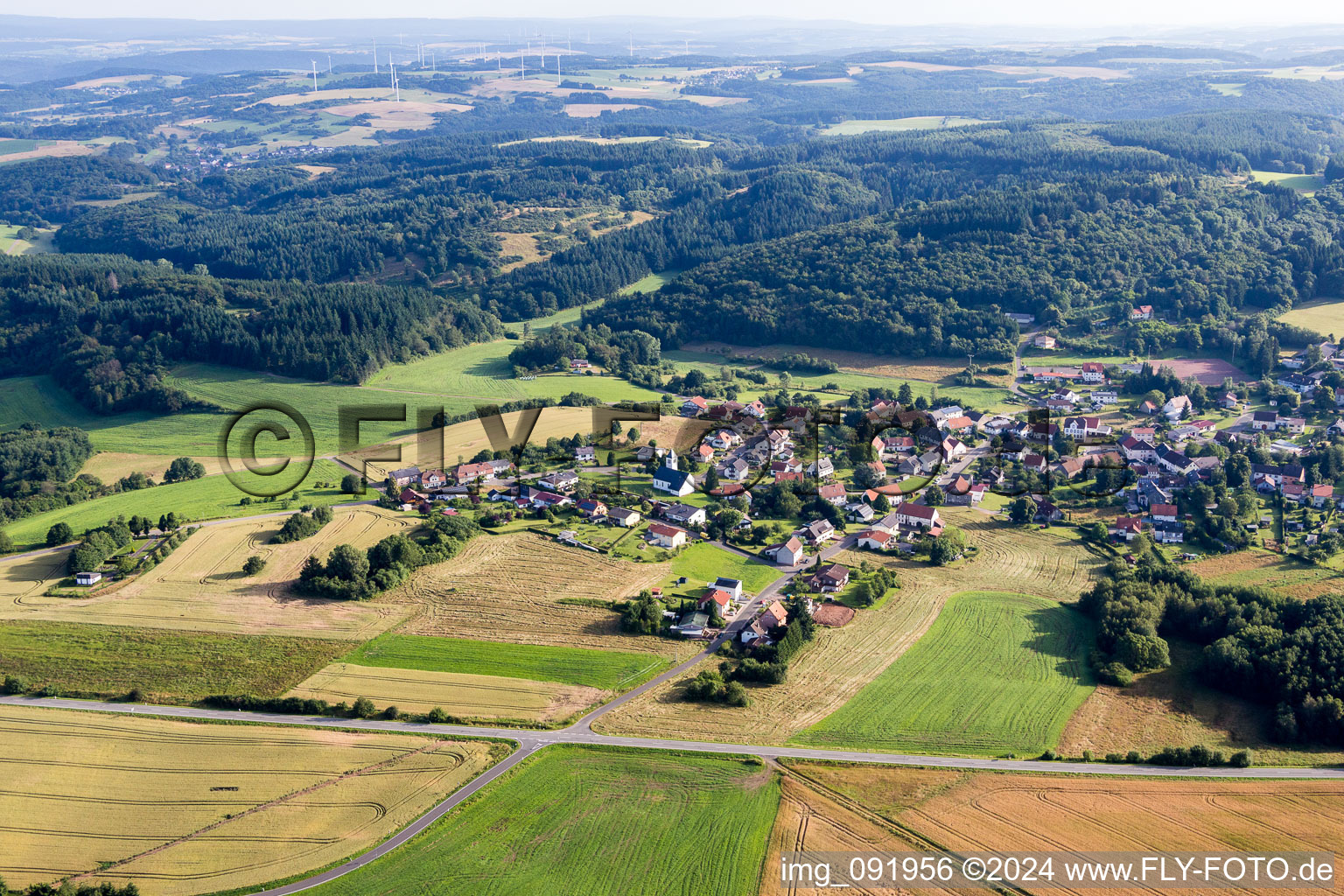 Village - view on the edge of agricultural fields and farmland in Reitscheid in the state Saarland, Germany