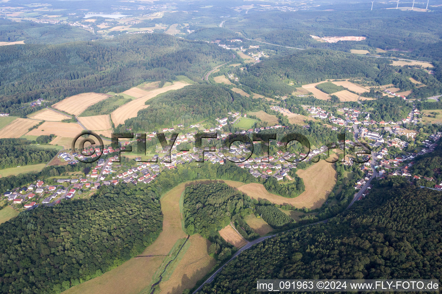 Village - view on the edge of agricultural fields and farmland in Nohfelden in the state Saarland, Germany