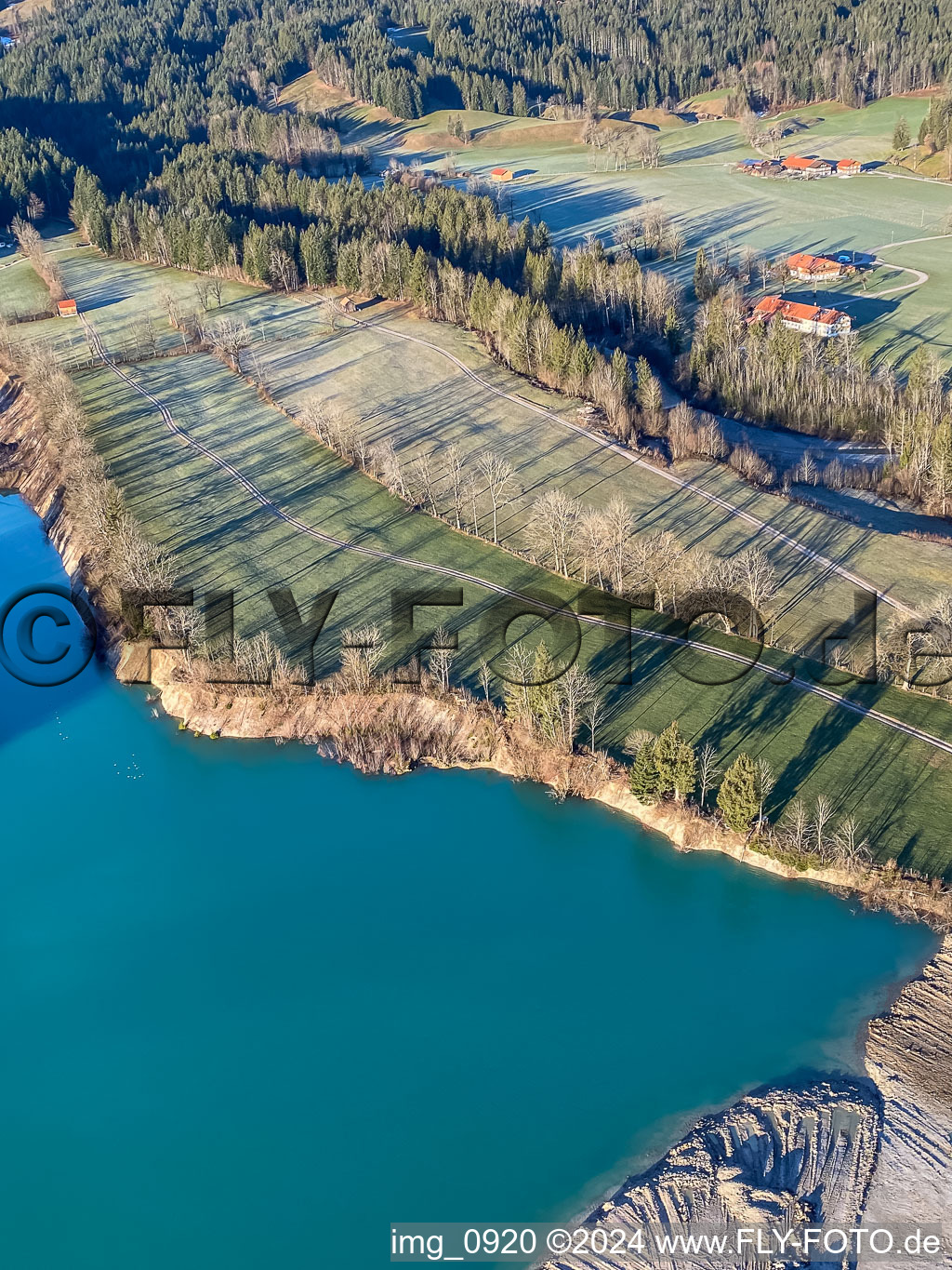 Shore of the quarry lake in the district Schlegldorf in Lenggries in the state Bavaria, Germany