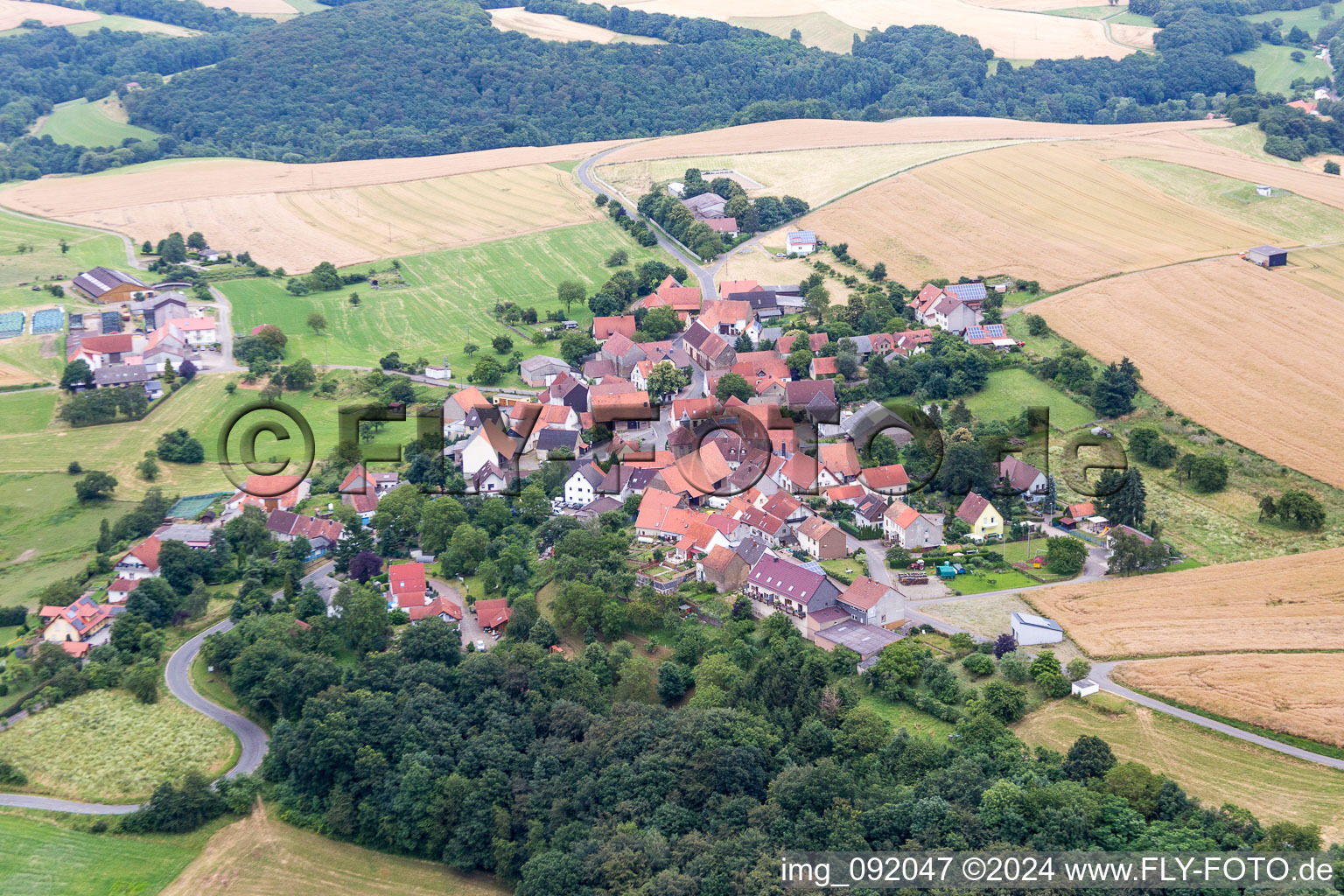 Village - view on the edge of agricultural fields and farmland in Seelen in the state Rhineland-Palatinate, Germany