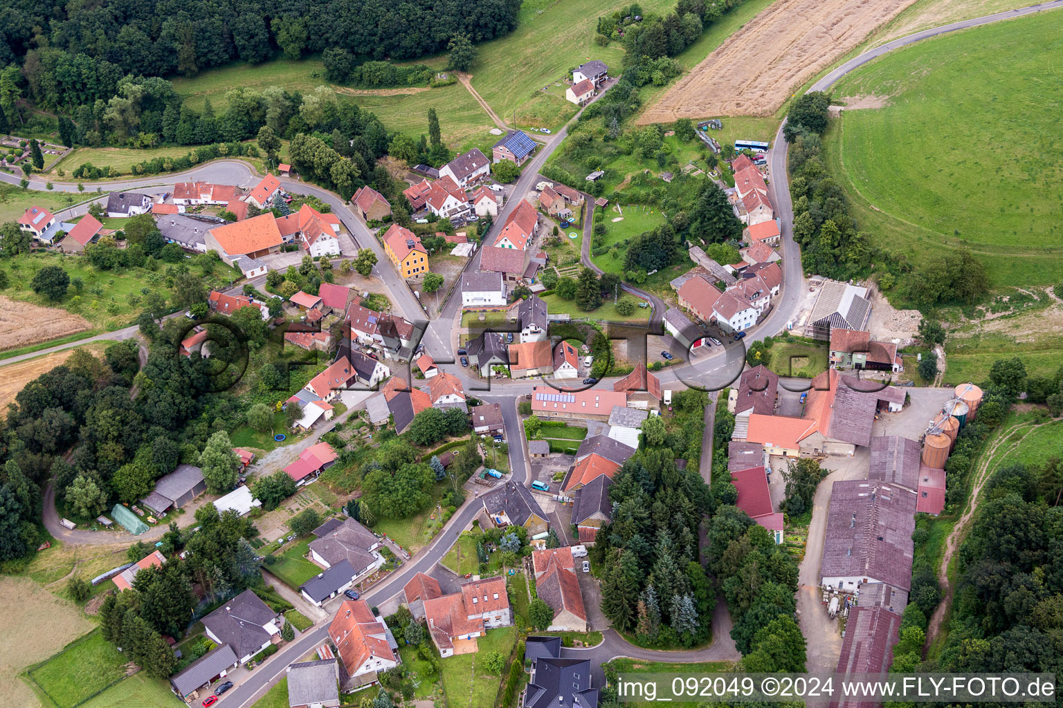 Village - view on the edge of agricultural fields and farmland in Reichsthal in the state Rhineland-Palatinate, Germany