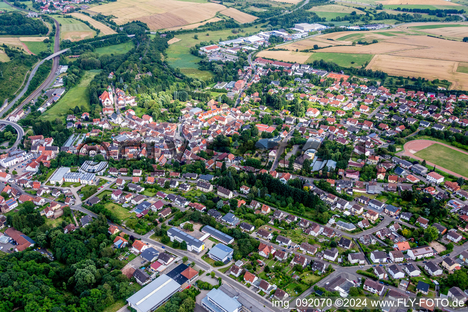 Aerial view of Church building of catholic Church Herz Jesu in Winnweiler in the state Rhineland-Palatinate, Germany
