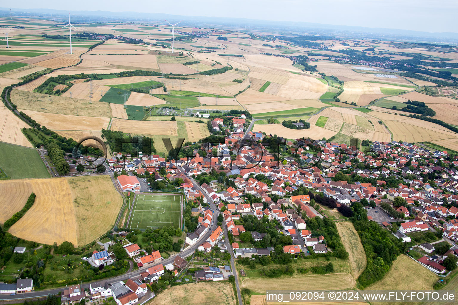 Village - view on the edge of agricultural fields and farmland in Kerzenheim in the state Rhineland-Palatinate, Germany
