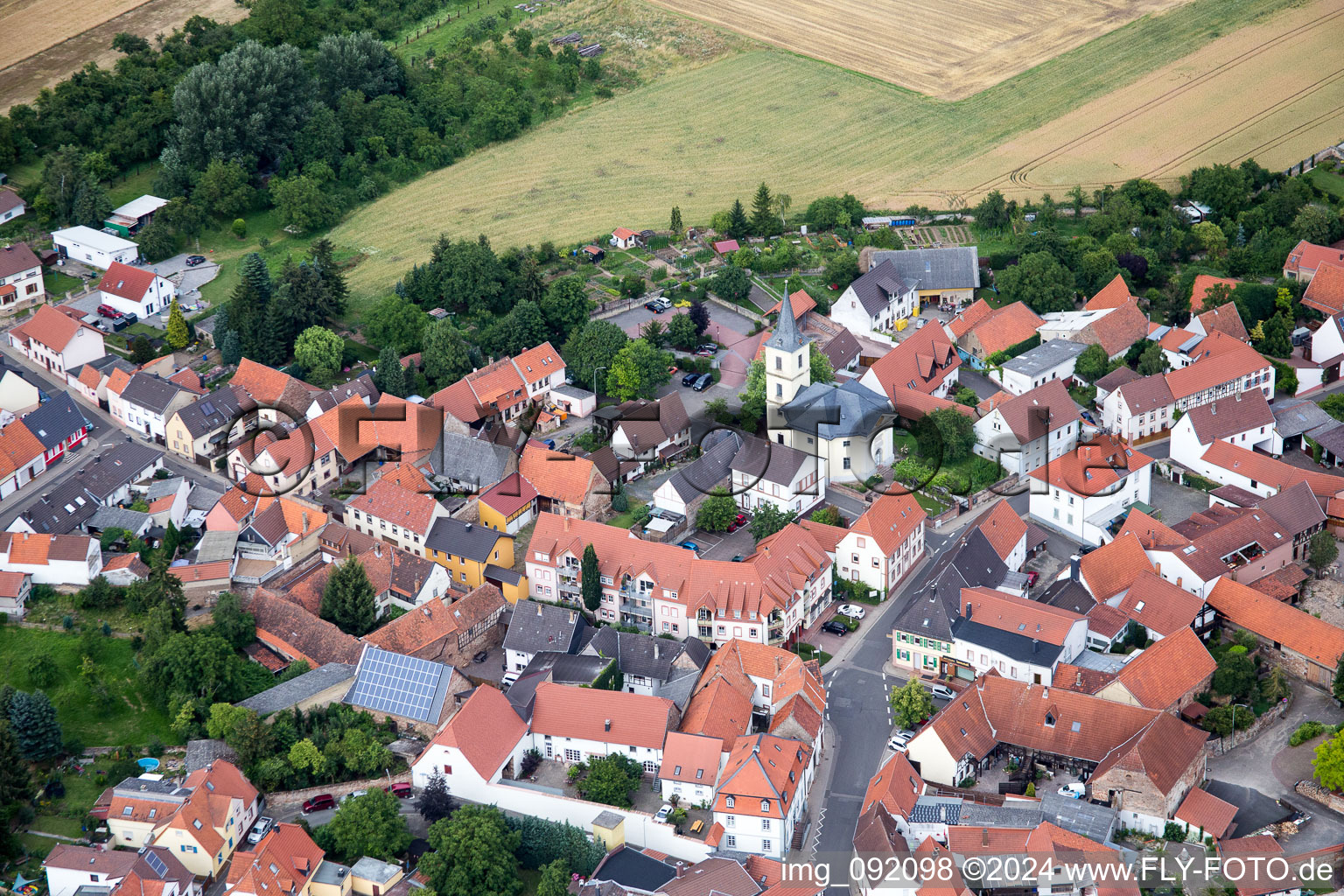 Aerial view of Village - view on the edge of agricultural fields and farmland in Kerzenheim in the state Rhineland-Palatinate, Germany
