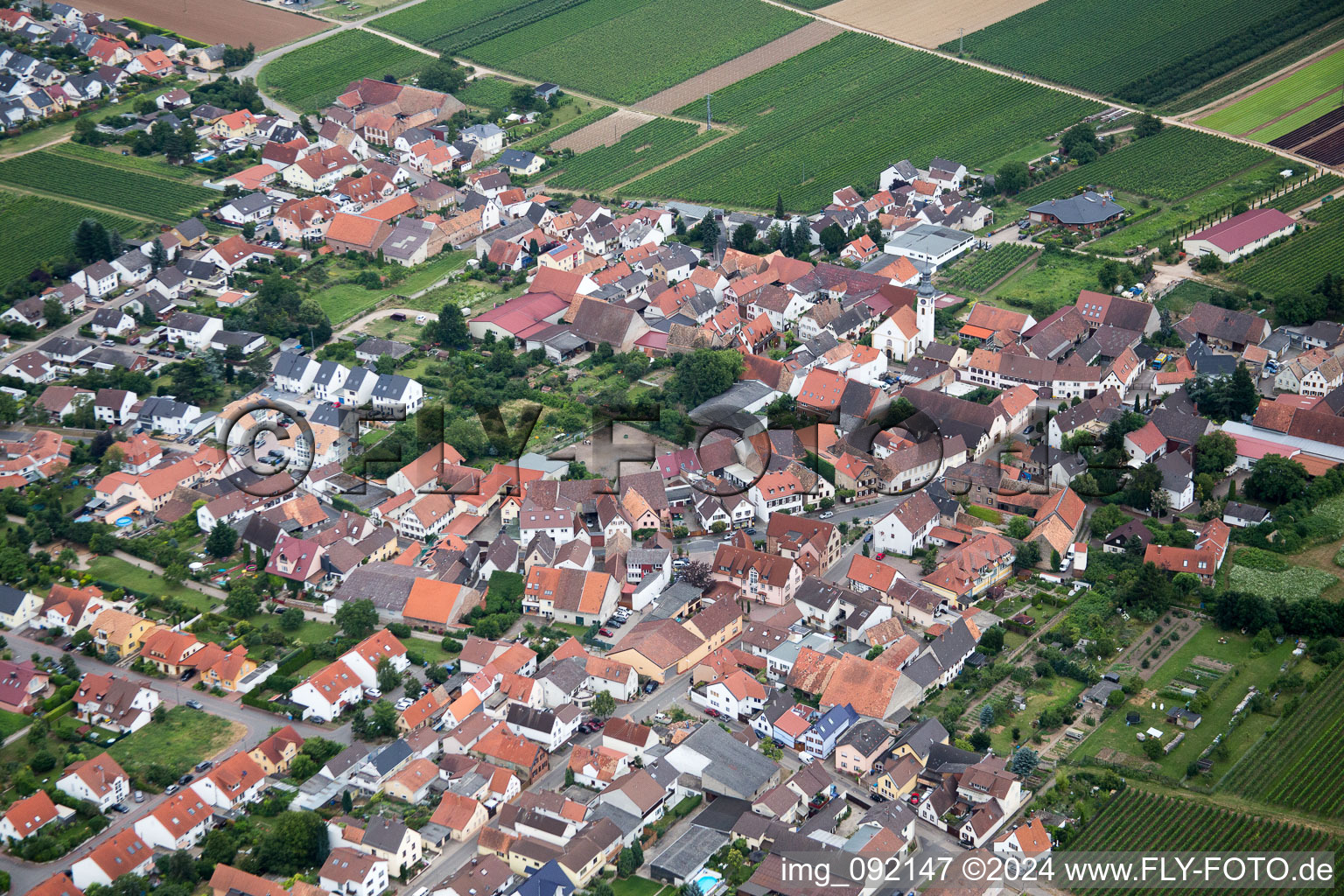 Village - view on the edge of agricultural fields and farmland in Goennheim in the state Rhineland-Palatinate, Germany