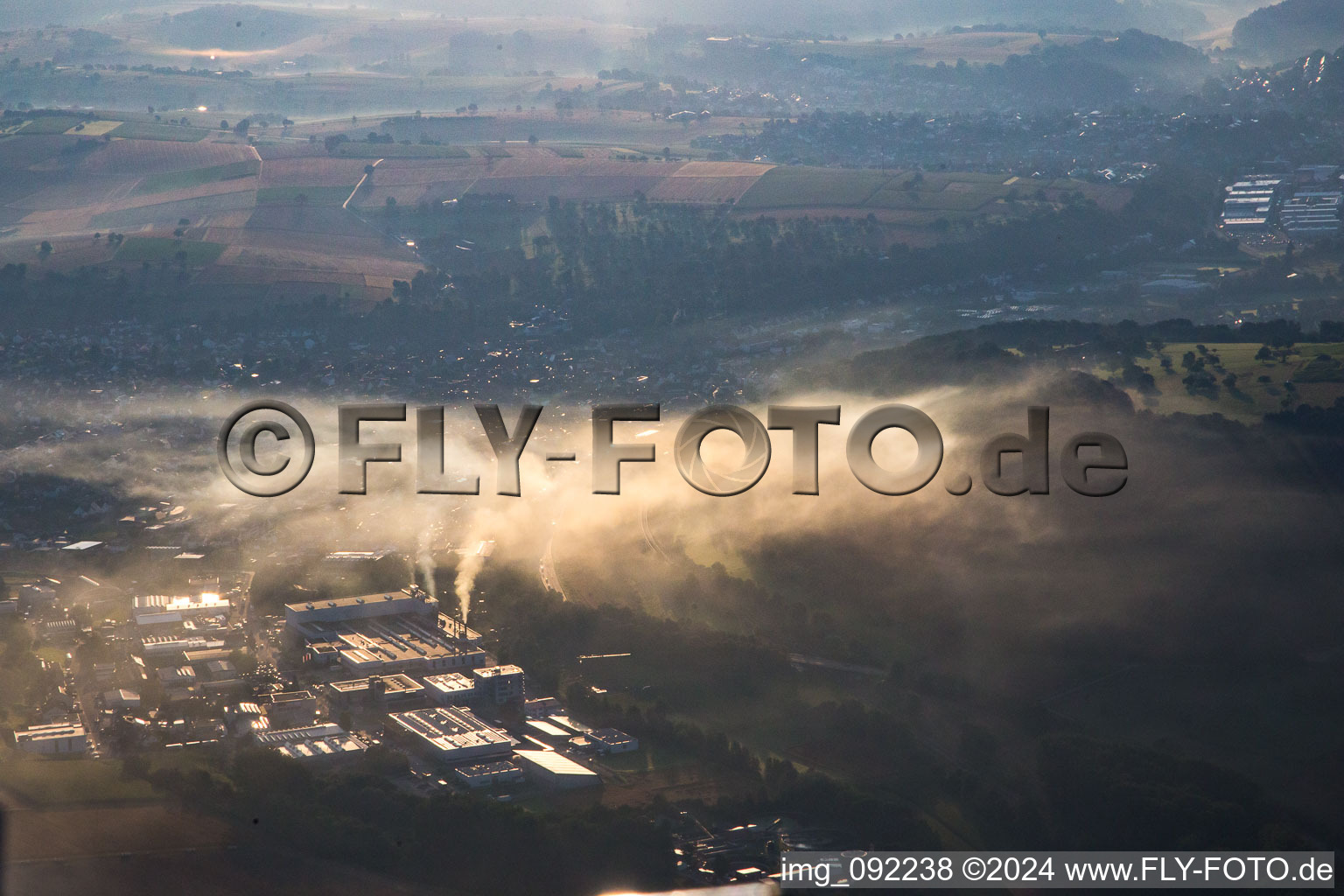 Hammerwerkstrasse industrial area in the morning mist in the district Kleinsteinbach in Pfinztal in the state Baden-Wuerttemberg, Germany