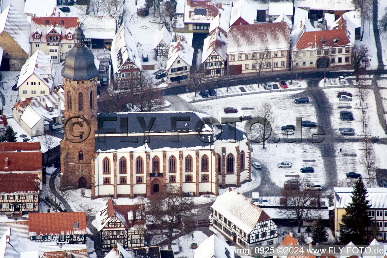 Wintry snowy Church building in of  church at the market in Old Town- center of downtown in Kandel in the state Rhineland-Palatinate