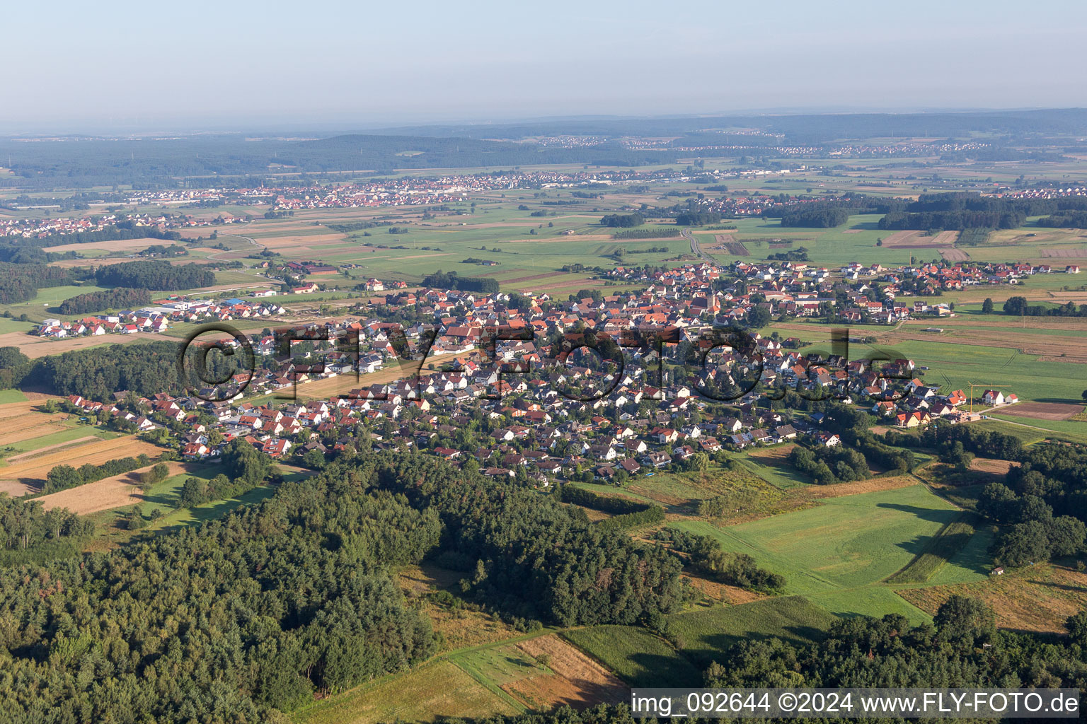 Village - view on the edge of agricultural fields and farmland in Langensendelbach in the state Bavaria, Germany