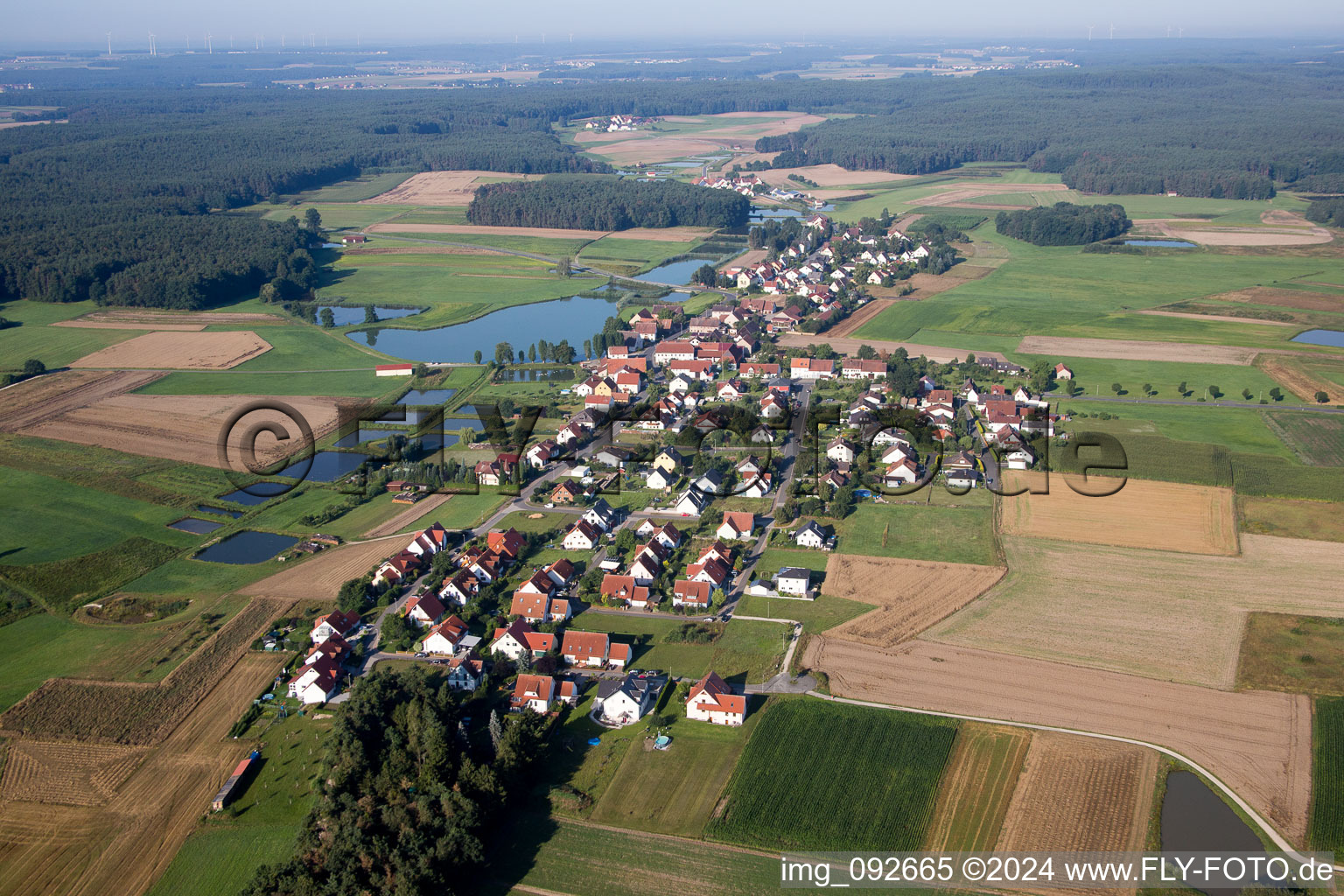 Village on the lake bank areas of the village in the district Untermembach in Hessdorf in the state Bavaria, Germany