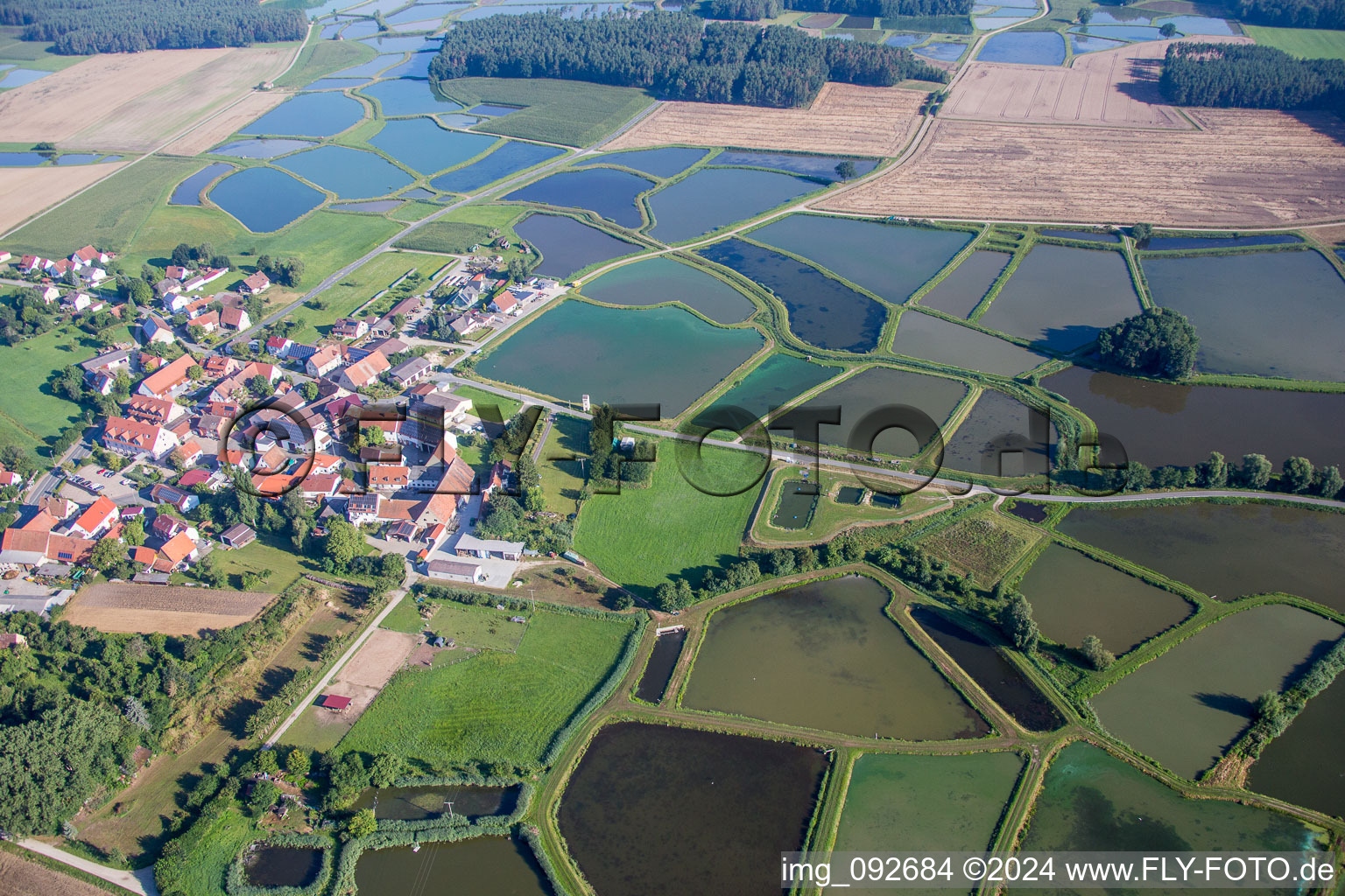 Aerial view of Shore areas of the ponds for carp fish farming in Oberlindach near Erlangen in Weisendorf in the state Bavaria