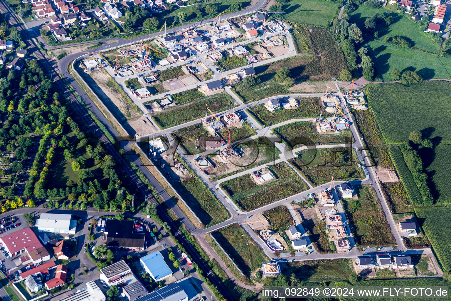 Construction sites for new construction residential area of detached housing estate In den Niederwiesen in Woerth am Rhein in the state Rhineland-Palatinate, Germany