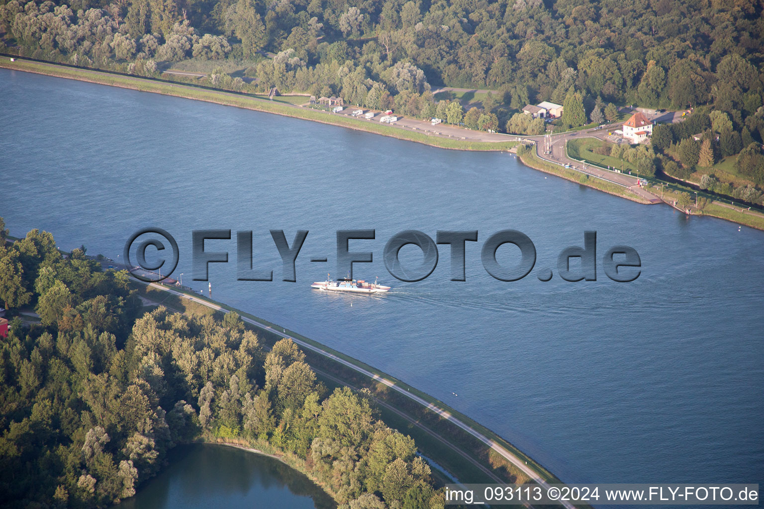 Ride a ferry ship crossing the Rhine river from Greffern to Drusenheim in Grand Est, France