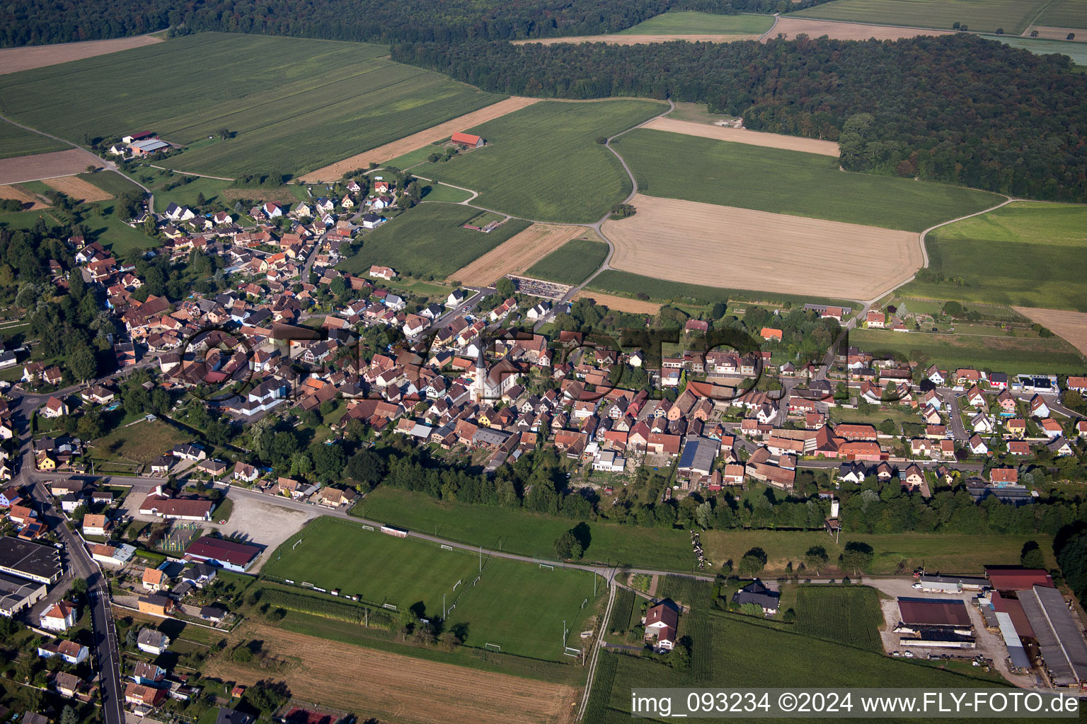 Aerial photograpy of Village - view on the edge of agricultural fields and farmland in Herbsheim in Grand Est, France