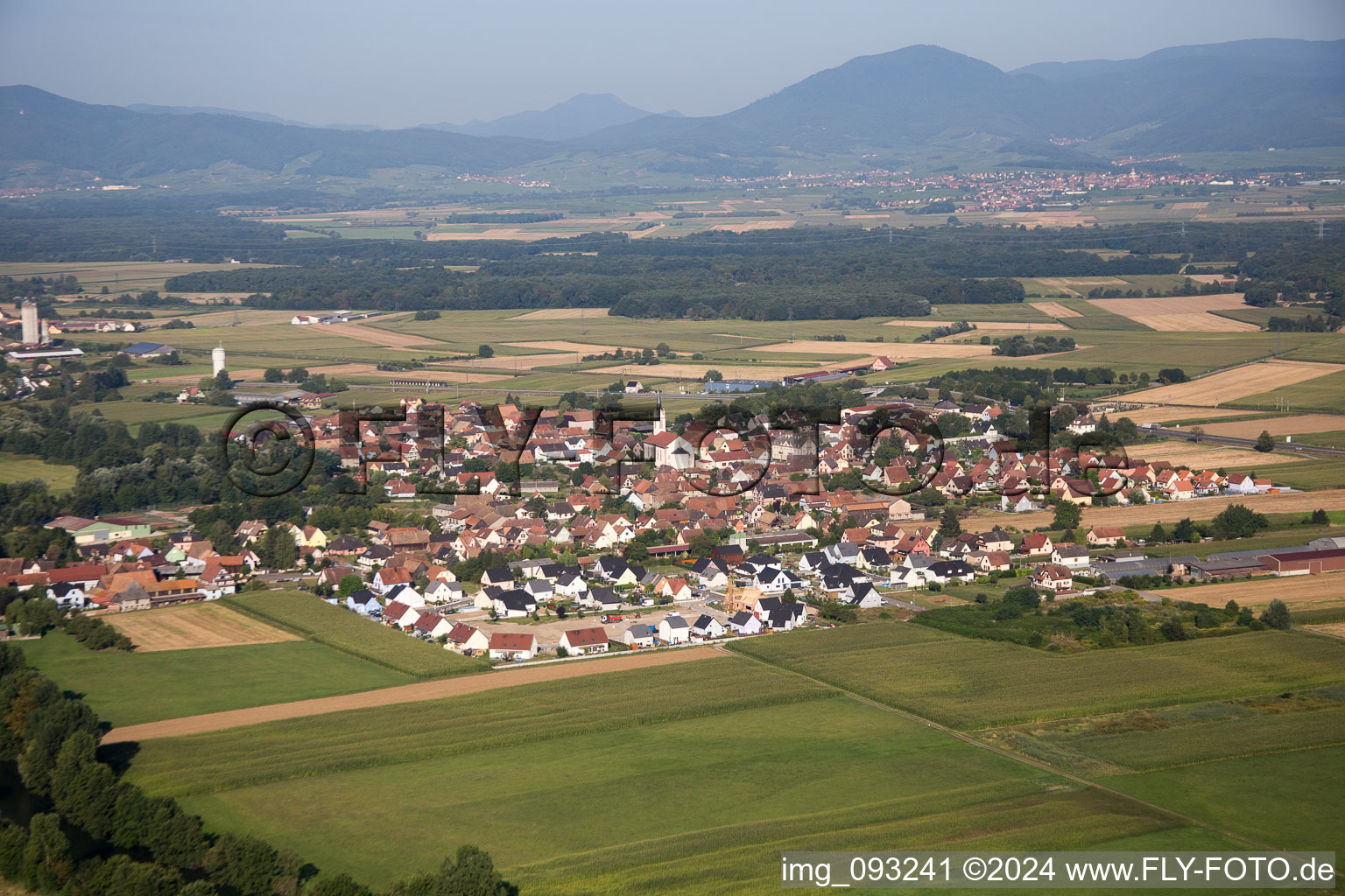 Aerial view of Village on the river bank areas of the river Ill in Sermersheim in Grand Est, France