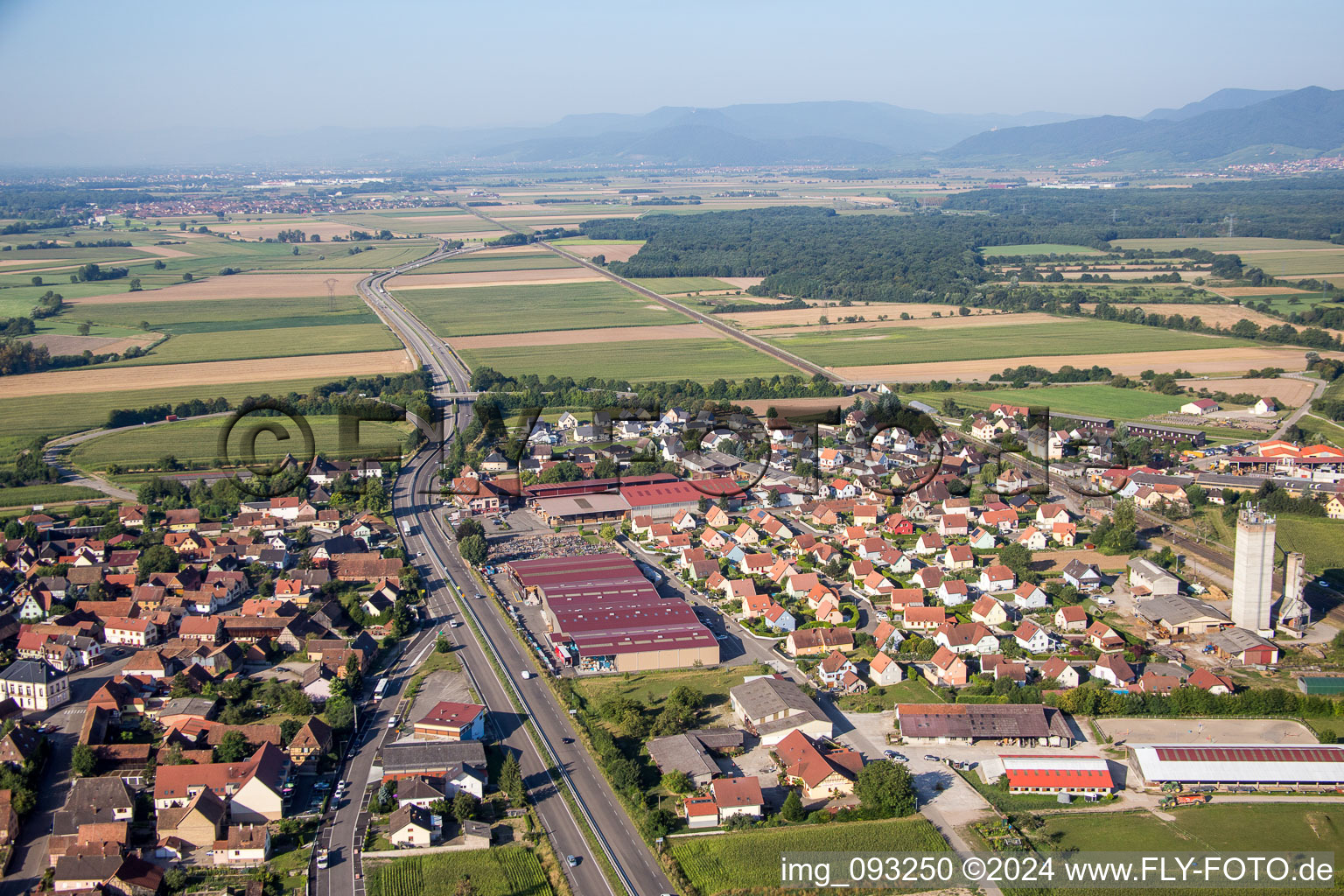 Aerial view of Village - view on the edge of agricultural fields and farmland in Kogenheim in Grand Est, France