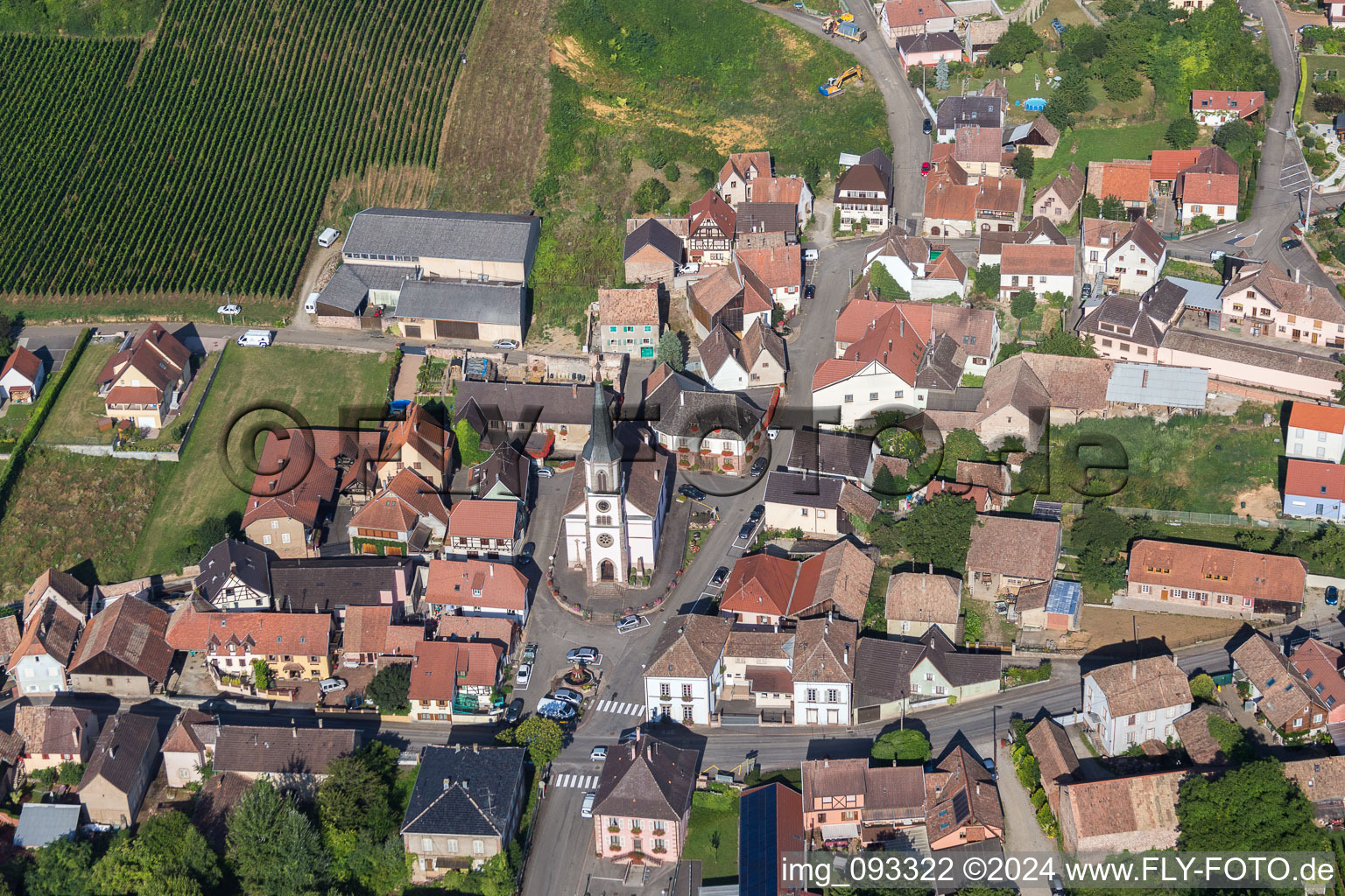 Aerial photograpy of Village - view on the edge of agricultural fields and farmland in Rorschwihr in Grand Est, France