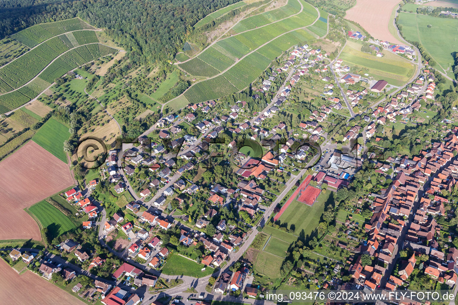 Aerial photograpy of Village - view on the edge of agricultural fields and farmland in Schuetzingen in the state Baden-Wurttemberg, Germany