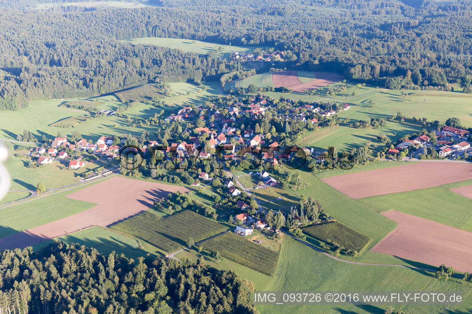 Village - view on the edge of agricultural fields and farmland in the district Grab in Grosserlach in the state Baden-Wurttemberg, Germany