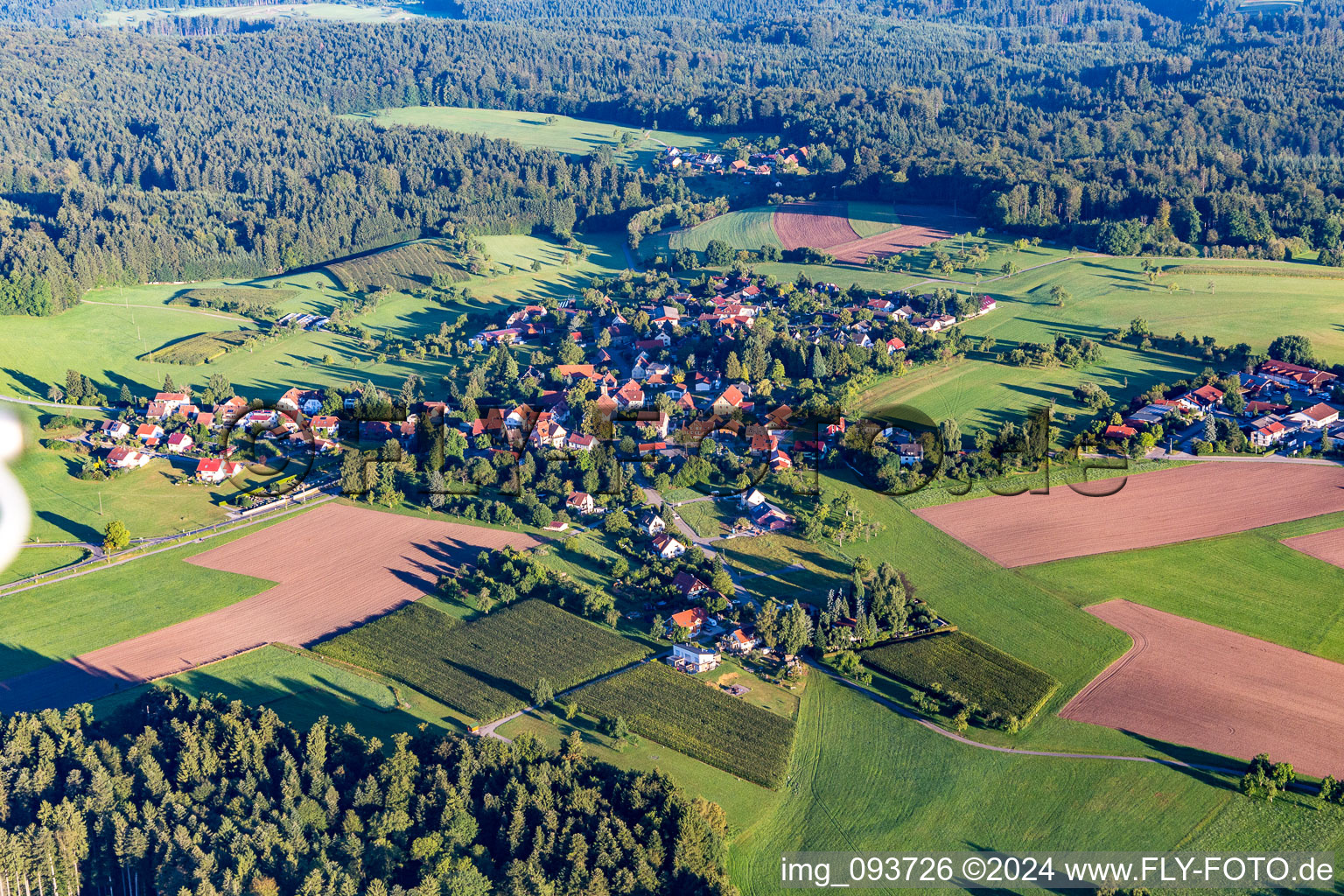 Village - view on the edge of agricultural fields and farmland in the district Grab in Grosserlach in the state Baden-Wurttemberg, Germany