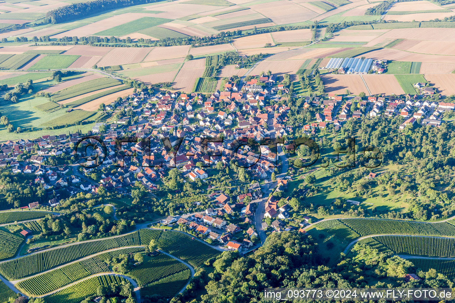 Village - view on the edge of agricultural fields and farmland in Winzerhausen in the state Baden-Wurttemberg, Germany