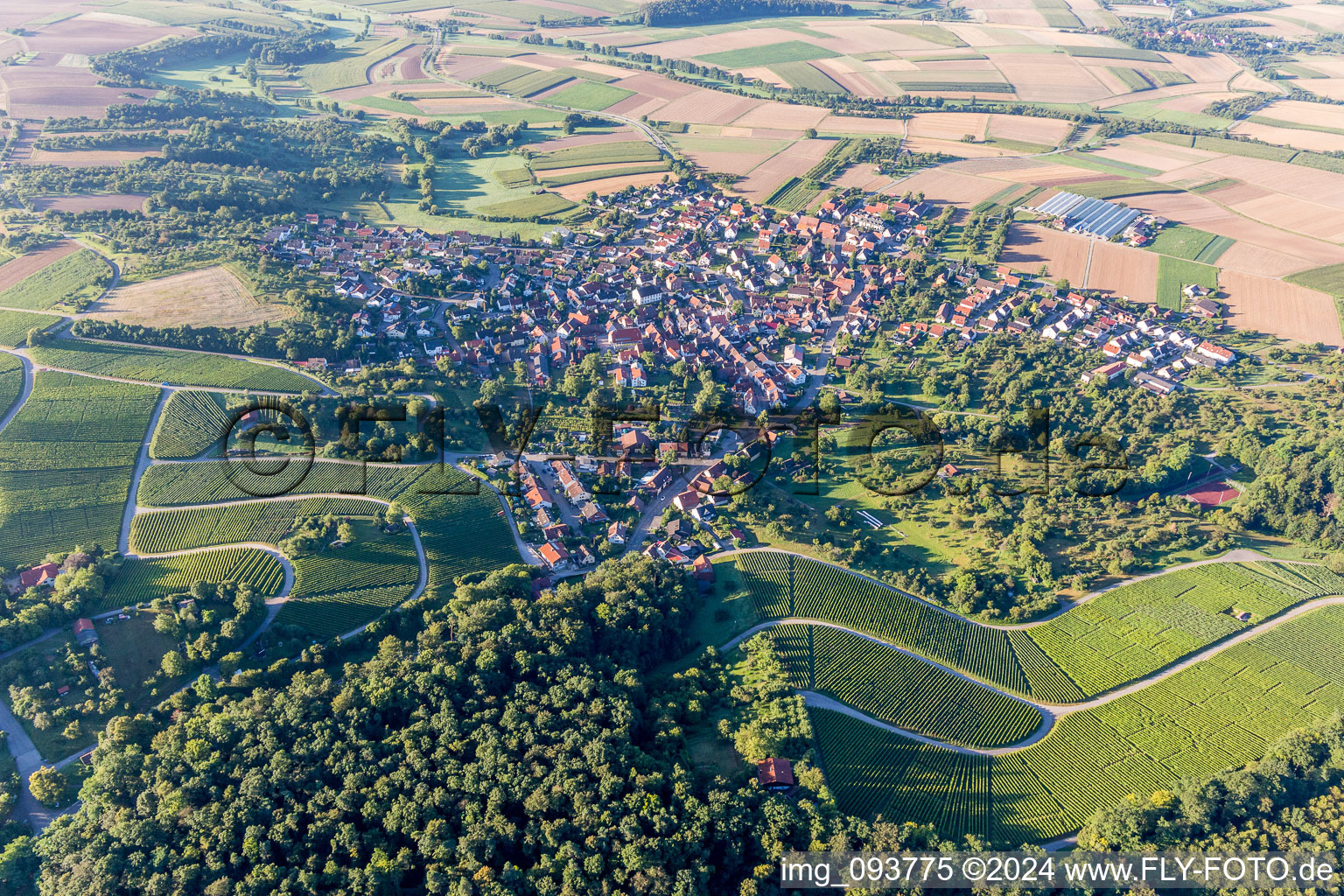 Aerial photograpy of Village - view on the edge of agricultural fields and farmland in Winzerhausen in the state Baden-Wurttemberg, Germany