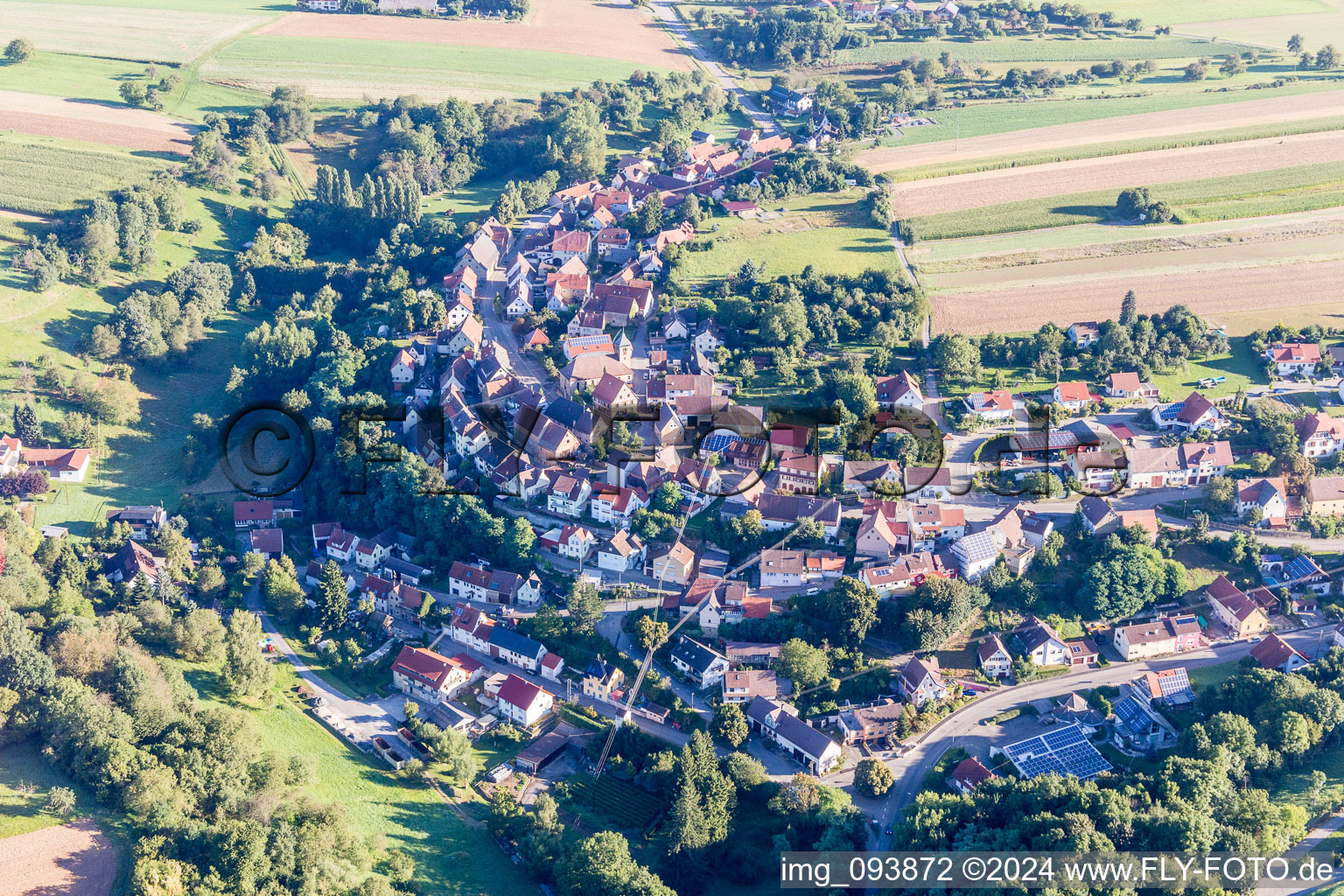 Village - view on the edge of agricultural fields and farmland in Ochsenburg in the state Baden-Wurttemberg, Germany