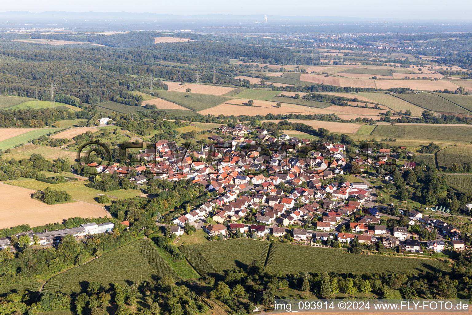 Village - view on the edge of agricultural fields and farmland in the district Oberacker in Kraichtal in the state Baden-Wurttemberg, Germany