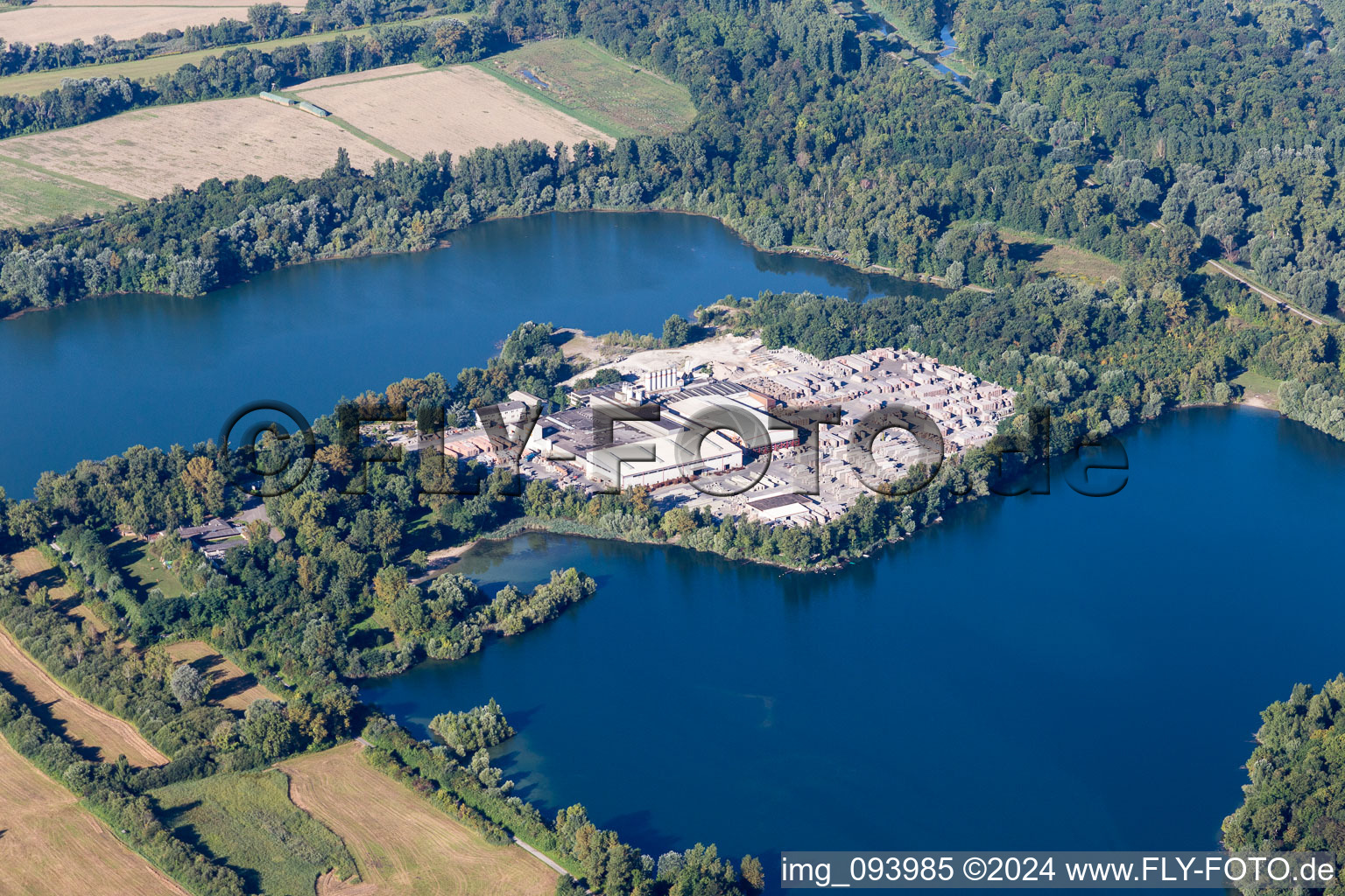 Aerial view of Mixed concrete and building materials factory of Lithonplus GmbH & Co. KG on lake Fuchs & Gros in Eggenstein-Leopoldshafen in the state Baden-Wurttemberg, Germany