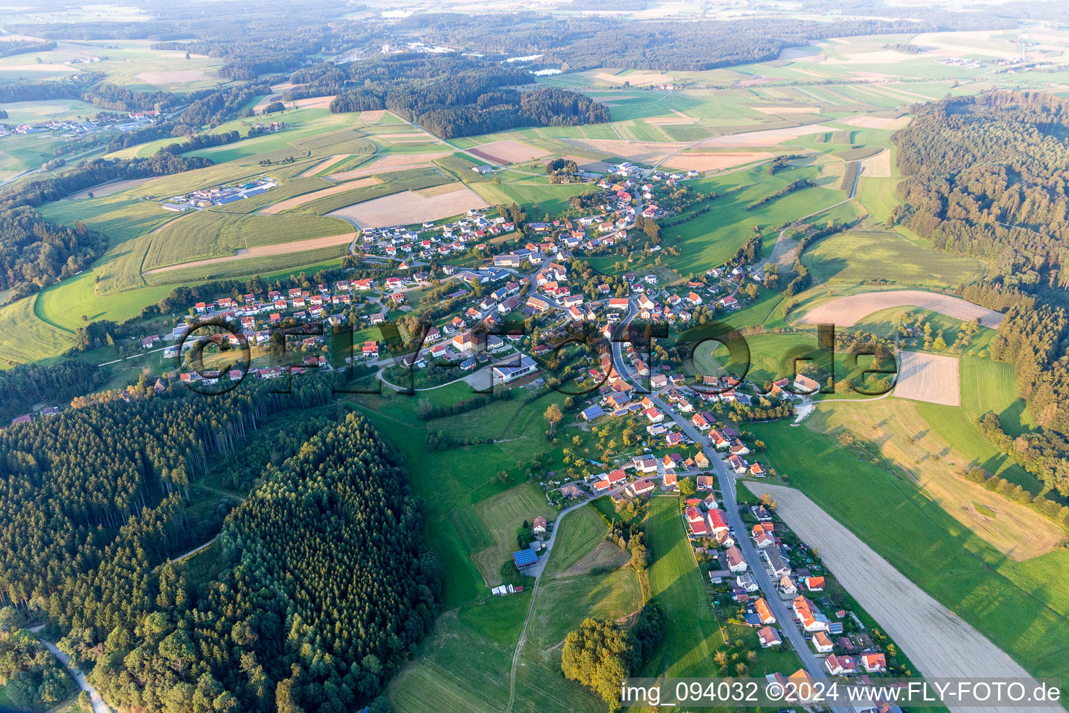 Village - view on the edge of agricultural fields and farmland in Zoznegg in the state Baden-Wurttemberg, Germany