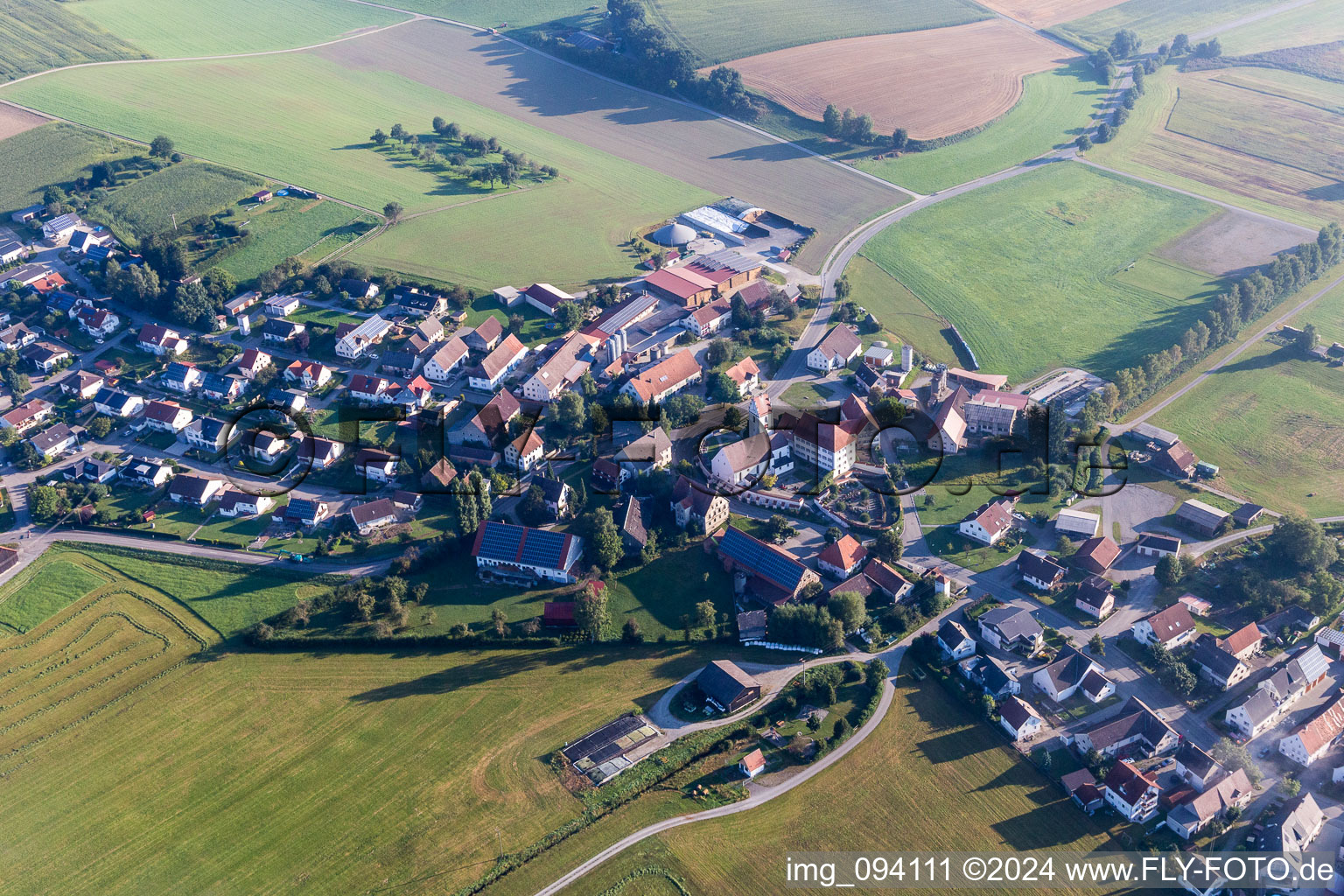 Village - view on the edge of agricultural fields and farmland in the district Moosheim in Bad Saulgau in the state Baden-Wurttemberg, Germany