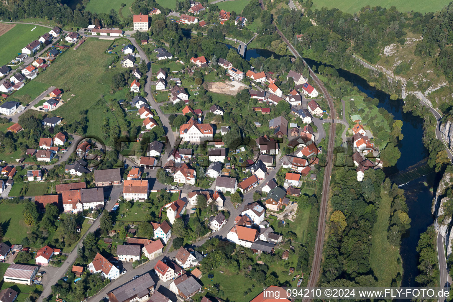 Aerial view of Village on the river bank areas of the river Danube in the district Gutenstein in Sigmaringen in the state Baden-Wurttemberg, Germany