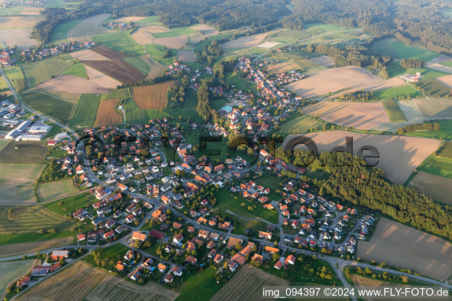 Aerial photograpy of Village - view on the edge of agricultural fields and farmland in Herdwangen-Schoenach in the state Baden-Wurttemberg, Germany